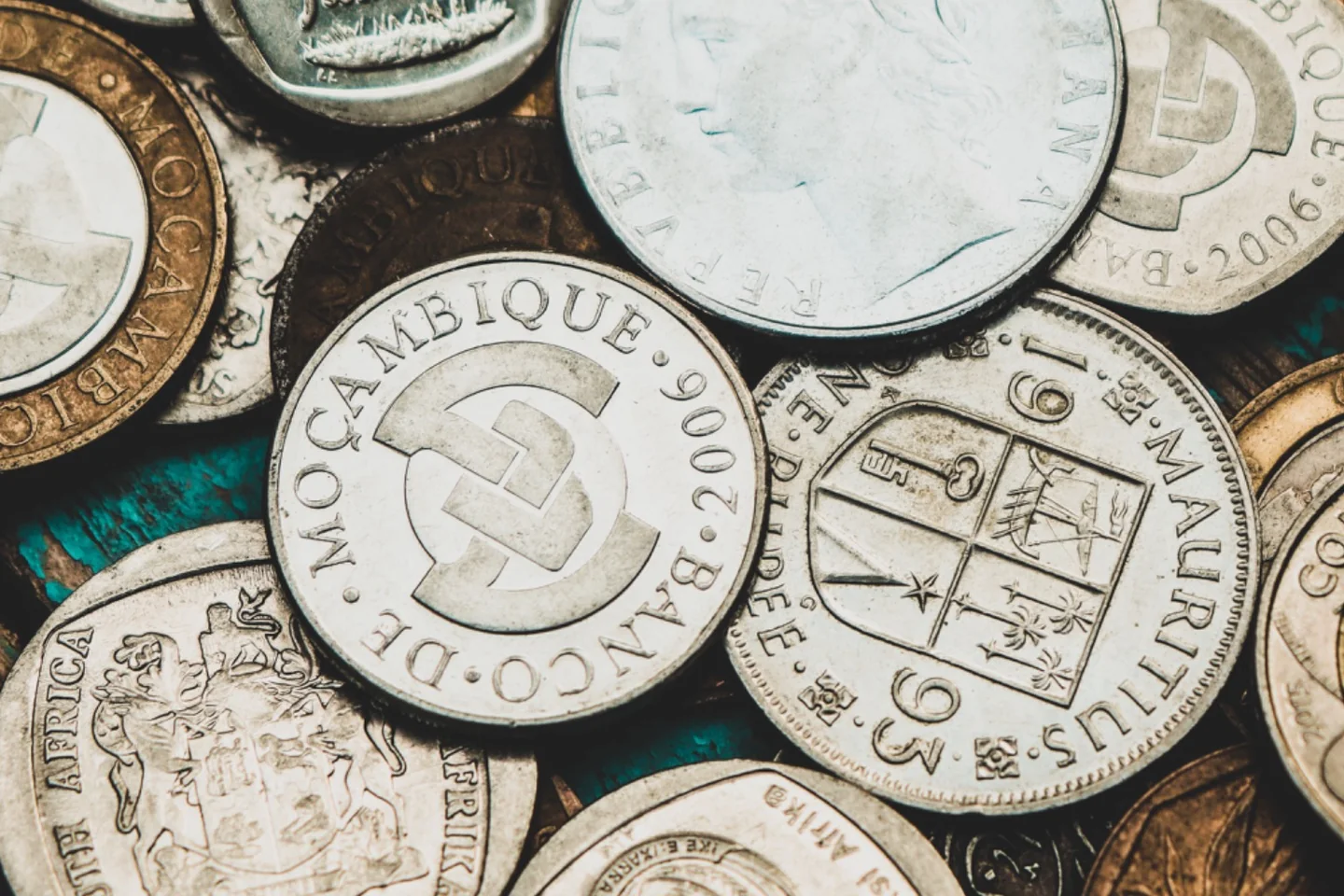 South African coins beside a savings notebook